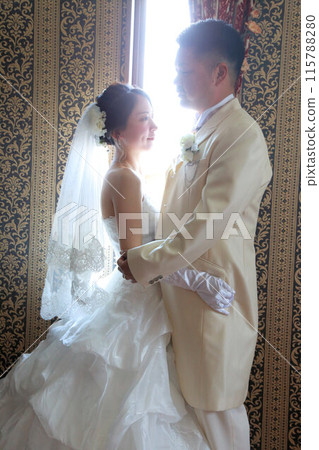Photo wedding indoor photography, bride in wedding dress and groom in tuxedo 115788280