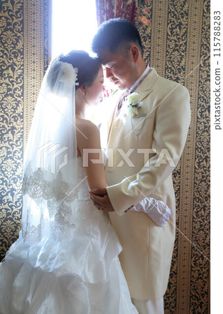 Photo wedding indoor photography, bride in wedding dress and groom in tuxedo 115788283