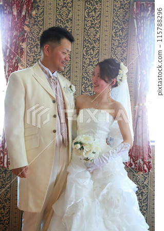 Photo wedding indoor photography, bride in wedding dress and groom in tuxedo 115788296