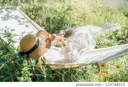 Woman relaxing in a hammock 115788415