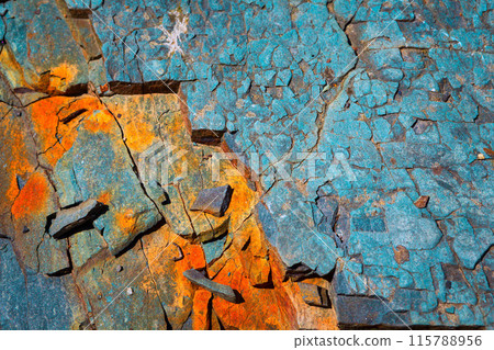 orange and blue stones by the river. background 115788956