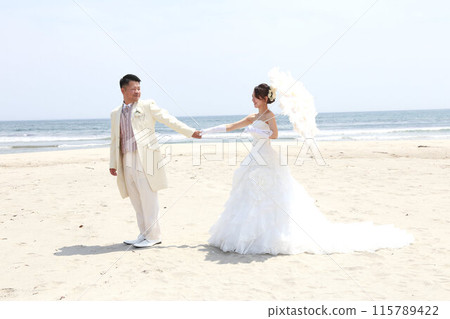Bride in a wedding dress and groom in a tuxedo Photo wedding beach location shoot Bride in a wedding dress and groom in a tuxedo Photo wedding beach location shoot 115789422