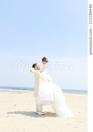 Bride in a wedding dress and groom in a tuxedo Photo wedding beach location shoot Bride in a wedding dress and groom in a tuxedo Photo wedding beach location shoot 115789440