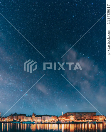 Stockholm, Sweden. Scenic Famous View Of Embankment In Old Town Of Stockholm In Night Lights. Great Church Or Church Of St. Nicholas And Royal Palace. Famous Popular Destination Scenic Place In Light 115789617
