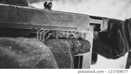 Usa Soldier With Old Thompson Sub-machine Gun. Close-up View Detail On Thompson Sub-machine Gun In Hands Of Re-enactor Dressed As American Infantry Soldier. Usa Army Soldiers Of World War Ii 115789677
