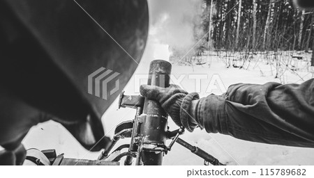 Heroes Of War. Mortar Shooting Explosions Forest. Close-up View On Re-enactors Dressed As American Infantry Soldiers Fire From Mortar. Usa Army Soldiers Of World War Ii. Reconstruction Defense Battles 115789682