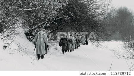 Men Dressed As White Guard Soldiers Of Imperial Russian Army In Russian Civil War s Marching Through Snowy Winter Forest. Army on Marching. Historical Reenactment of Civil War. Black And White Men Dressed As White Guard Soldiers Of Imperial Russian Army In Russian Civil War s Marching Through Snowy Winter Forest. Army on Marching. Historical Reenactment of Civil War. Black And White 115789712