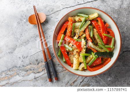 Zucchini And Bell Pepper Stir Fry closeup on the plate. Horizontal top view 115789741