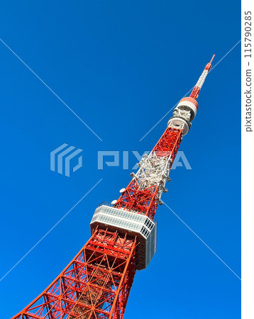 Tokyo Tower shining against a cloudless blue sky 115790285
