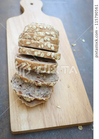 bread , whole wheat bread or sourdough bread or loaf of bread or cranberry and whole grain bread in the tray 115790561