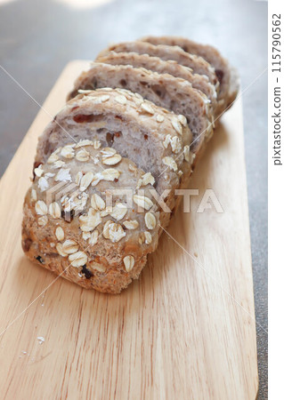 bread , whole wheat bread or sourdough bread or loaf of bread or cranberry and whole grain bread in the tray bread , whole wheat bread or sourdough bread or loaf of bread or cranberry and whole grain bread in the tray 115790562