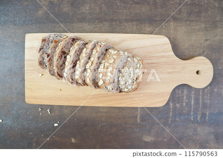 bread , whole wheat bread or sourdough bread or loaf of bread or cranberry and whole grain bread in the tray 115790563