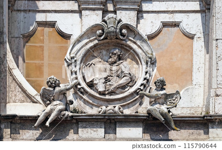 Saint Luke the Evangelist, statue on facade of the Mantua Cathedral dedicated to Saint Peter, Mantua, Italy 115790644