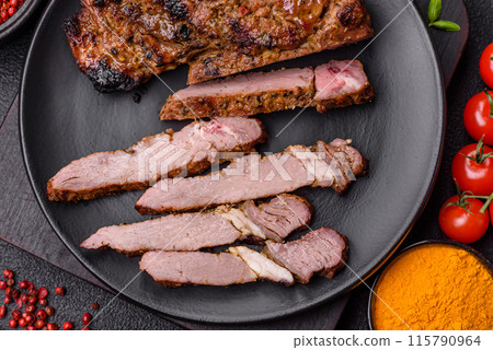 Juicy beef tomahawk steak on the bone baked on the grill 115790964