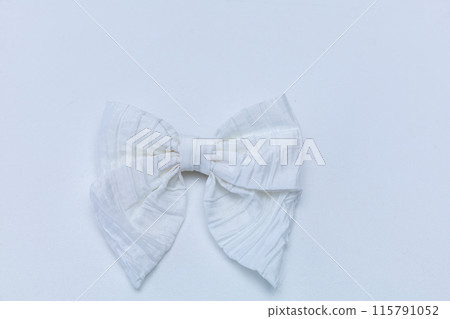 Satin bow for hair for girl, woman isolated on white background. Scrunchie hair clip accessory for girls and women. Close up 115791052