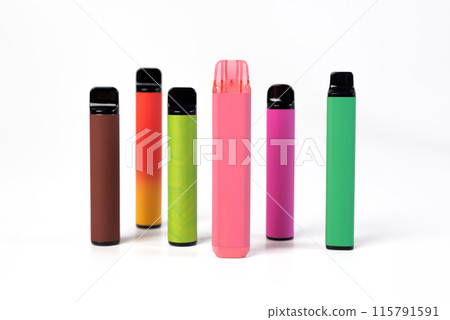 A set of colorful disposable electronic cigarettes of different shapes on a white background. modern smoking. A set of colorful disposable electronic cigarettes of different shapes on a white background. modern smoking. 115791591