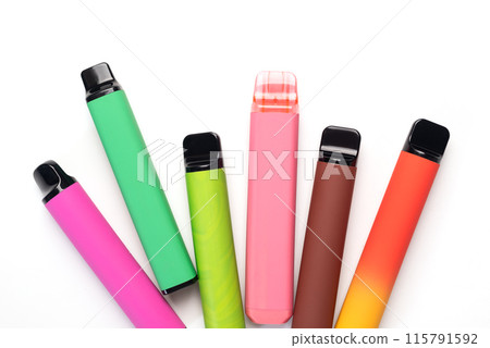A set of colorful disposable electronic cigarettes of different shapes on a white background. modern smoking. A set of colorful disposable electronic cigarettes of different shapes on a white background. modern smoking. 115791592