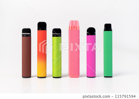 A set of colorful disposable electronic cigarettes of different shapes on a white background. modern smoking.  115791594