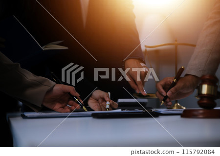 Judge gavel with Justice lawyers having team meeting at law firm background. Concepts of Law and Legal services. 115792084