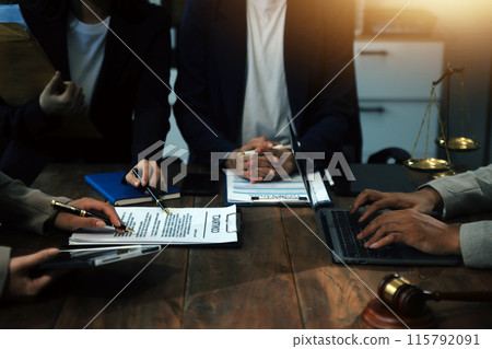 Judge gavel with Justice lawyers having team meeting at law firm background. Concepts of Law and Legal services. 115792091