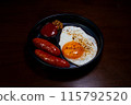 Breakfast plate, fried egg, sausage, bird's-eye view 115792520