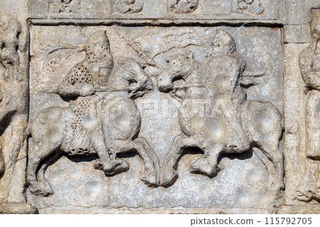 Knights fight horseback with lance and shield, medieval relief on the facade of Basilica of San Zeno in Verona, Italy Knights fight horseback with lance and shield, medieval relief on the facade of Basilica of San Zeno in Verona, Italy 115792705