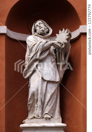 Saint Francis statue on the portal of St. Barnabas Church in Modena, Italy 115792774
