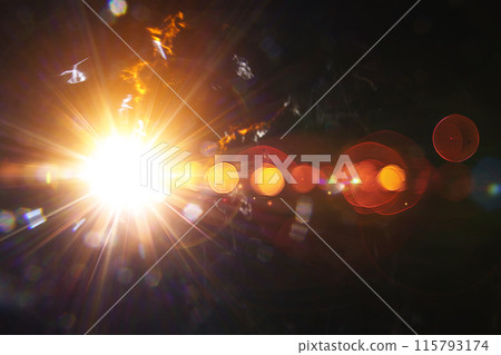 Abstract imitation sun starlight distant galaxy on a black background. 115793174