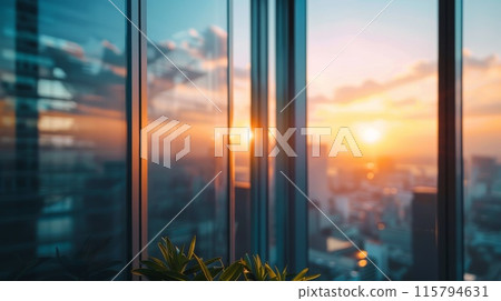 Urban Skyline Sunset Reflection on Modern Glass Skyscraper with Plant in Foreground Urban Skyline Sunset Reflection on Modern Glass Skyscraper with Plant in Foreground 115794631