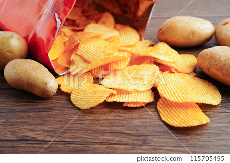 Potato chips , delicious BBQ seasoning spicy for crips, thin slice deep fried snack fast food. Potato chips , delicious BBQ seasoning spicy for crips, thin slice deep fried snack fast food. 115795495