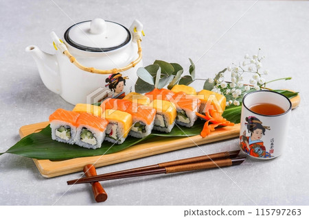 Philadelphia roll sushi with salmon, prawn, avocado, cream cheese. Sushi menu. Japanese food. Philadelphia roll sushi with salmon, prawn, avocado, cream cheese. Sushi menu. Japanese food. 115797263