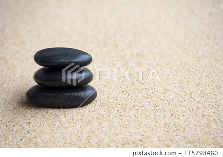 Zen stones on beach sand with customizable space for text or ideas Zen stones on beach sand with customizable space for text or ideas 115798480