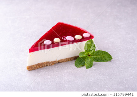 Isolated mini raspberry mousse cake on the white background. Isolated mini raspberry mousse cake on the white background. 115799441