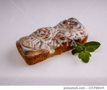 Freshly baked cinnamon buns on an orange background top view. patern. copy space 115799445