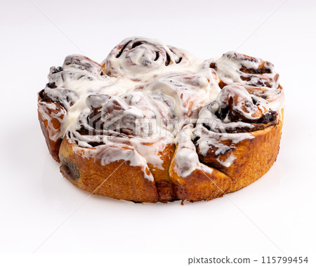 Freshly baked cinnamon buns on an orange background top view. patern. copy space 115799454