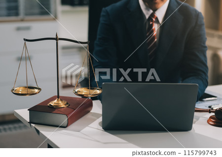 Male lawyer working with contract papers and wooden gavel on tabel in courtroom. justice and law ,attorney, court judge, concept. 115799743
