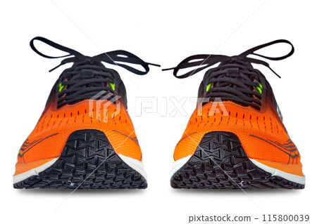 Pair of orange running sneakers photographed in front isolated on a white background. selective focus Pair of orange running sneakers photographed in front isolated on a white background. selective focus 115800039
