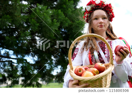 Ukrainian girl apples young woman in traditional Russian clothes with a basket of apples in hands forest. Slow motion Ukrainian girl apples young woman in traditional Russian clothes with a basket of apples in hands forest. Slow motion 115800306