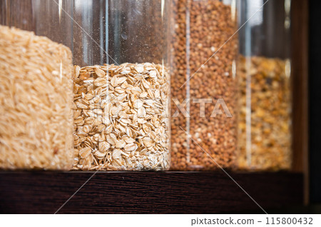 Organizing food storage in the kitchen, transparent reusable jars for cereals and pasta, zero waste pantry Organizing food storage in the kitchen, transparent reusable jars for cereals and pasta, zero waste pantry 115800432