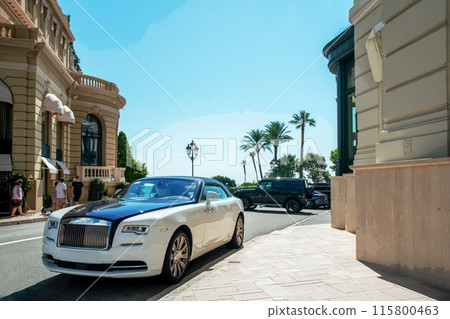 Luxury car in parking lot in 5 meters from old building of casino Monte Carlo Luxury car in parking lot in 5 meters from old building of casino Monte Carlo 115800463