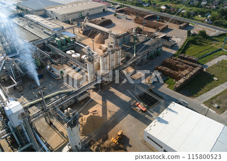 Aerial view of oil and gas refining petrochemical factory with tall refinery plant manufacture structure. Aerial view of oil and gas refining petrochemical factory with tall refinery plant manufacture structure. 115800523