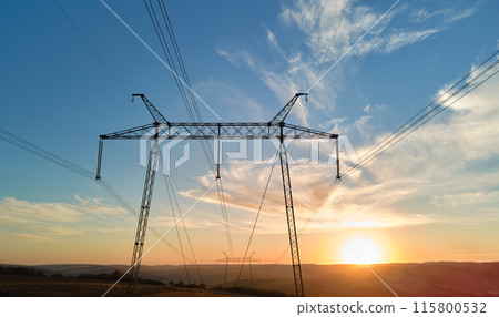 High voltage tower with electric power lines at sunset. Transmission of electricity 115800532