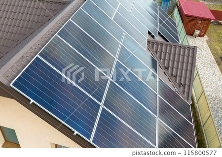 Aerial view building roof with rows of blue solar photovoltaic panels for producing clean ecological electric energy. Renewable electricity with zero emission concept 115800577