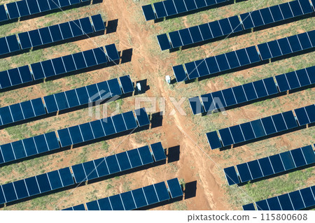 Aerial view of large sustainable electrical power plant with rows of solar photovoltaic panels for producing clean electric energy. Concept of renewable electricity with zero emission 115800608