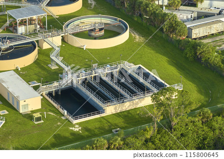 Aerial view of modern water cleaning facility at urban wastewater treatment plant. Purification process of removing undesirable chemicals, suspended solids and gases from contaminated liquid 115800645