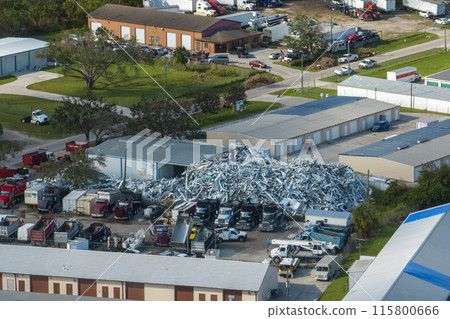 Beg pile of scrap aluminum metal siding from ruined houses after hurricane Ian swept through Florida. Recycle of broken parts of mobile homes Beg pile of scrap aluminum metal siding from ruined houses after hurricane Ian swept through Florida. Recycle of broken parts of mobile homes 115800666