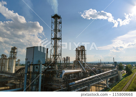 Aerial view of oil and gas refining petrochemical factory with tall refinery plant manufacture structure. Aerial view of oil and gas refining petrochemical factory with tall refinery plant manufacture structure. 115800668