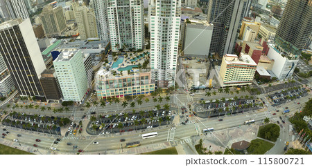 Aerial view of heavy traffic on urban street in downtown office district of Miami Brickell in Florida, USA. High commercial and residential skyscraper buildings in modern american megapolis 115800721