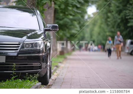 Close up of a car parked on city street side. Urban traffic concept 115800784