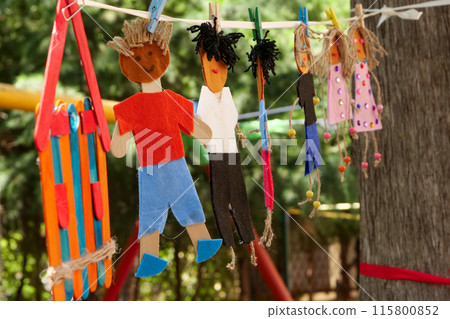 Popsicle stick dolls are hanging at outdoors 115800852